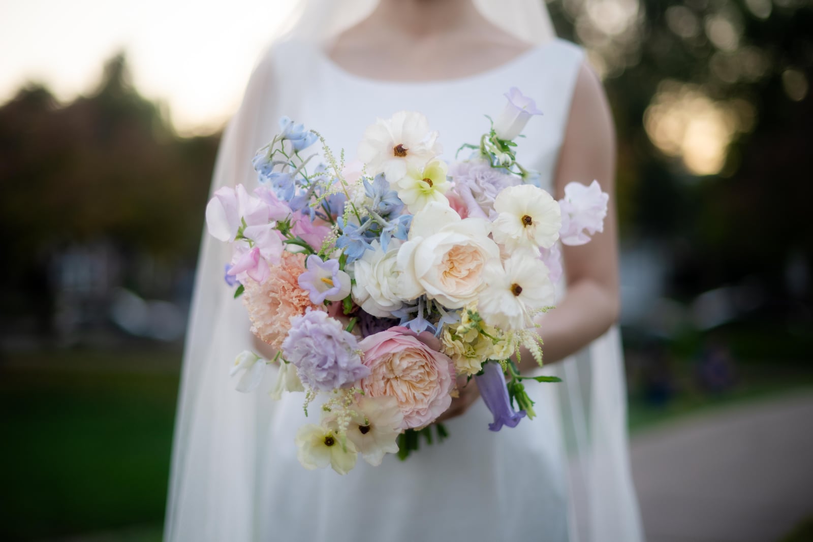 Bride holding a pastel garden bouquet